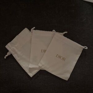 Dior Cream Drawstring Bags